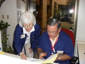 Volunteers reading notes